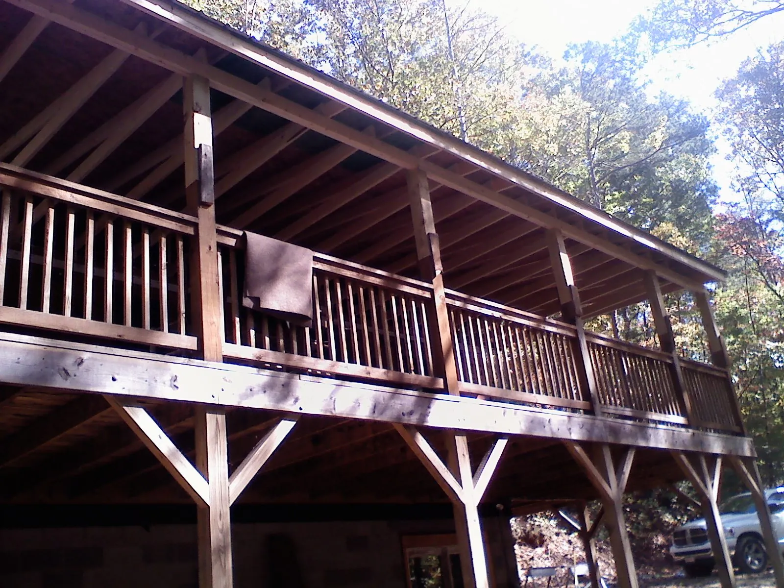 Timber framing under a new elevated porch and deck — Roof Leak Repair in West Yellowstone by Roofing Brothers